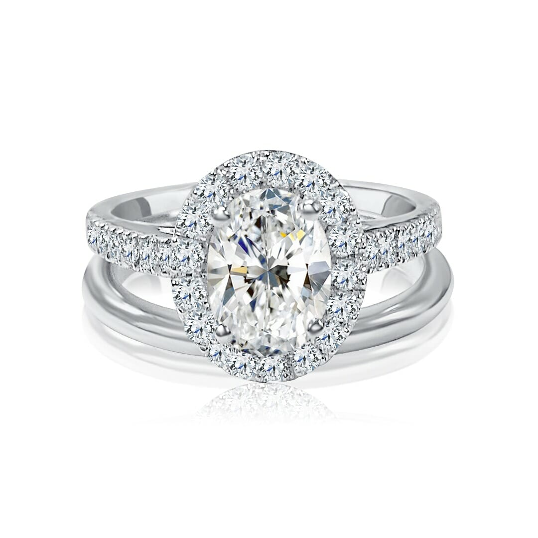 Halo Set Oval Cut Engagement Ring With Sidestones