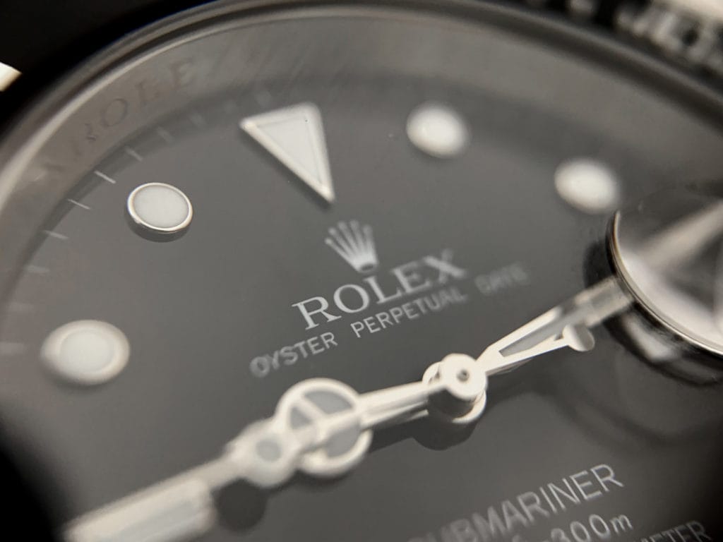 easy-to-read hour markers, visible on a Rolex's Submariner dial